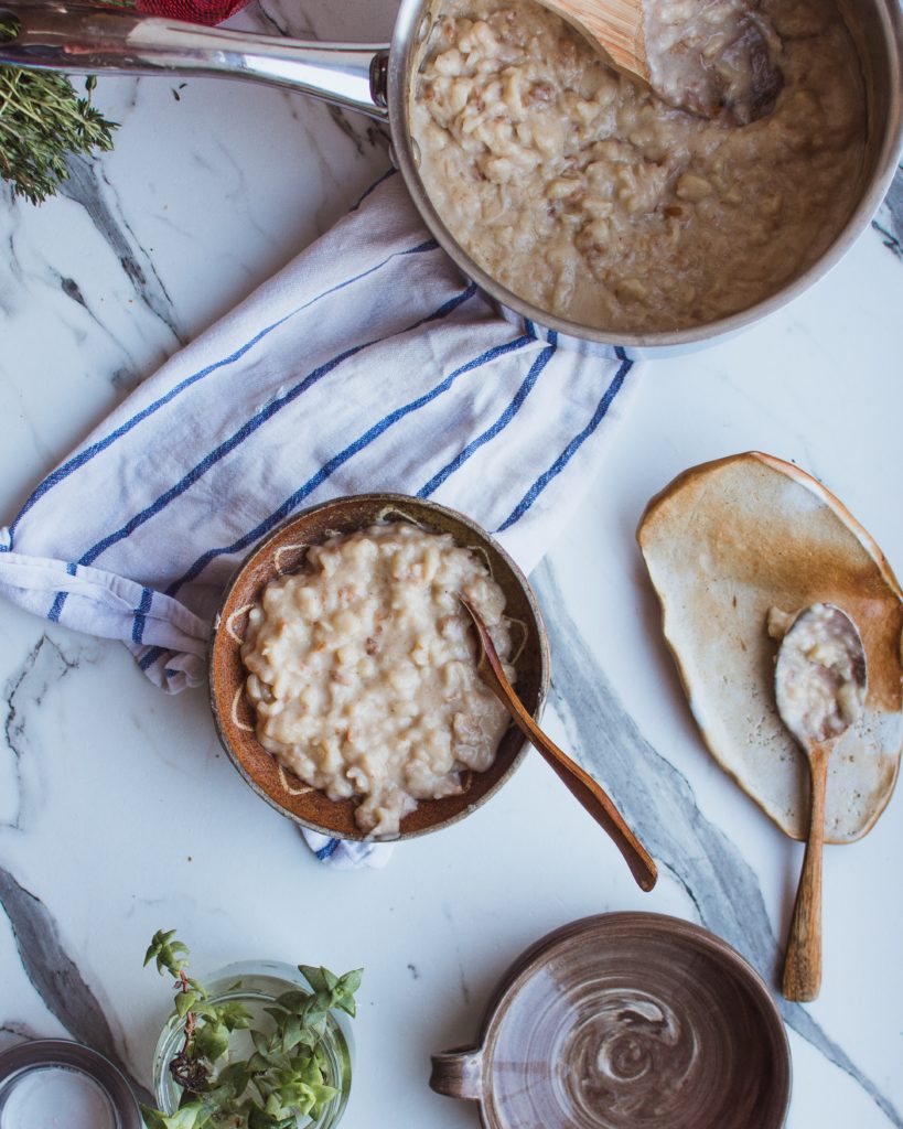 pot of oatmeal against rustic table backdrop